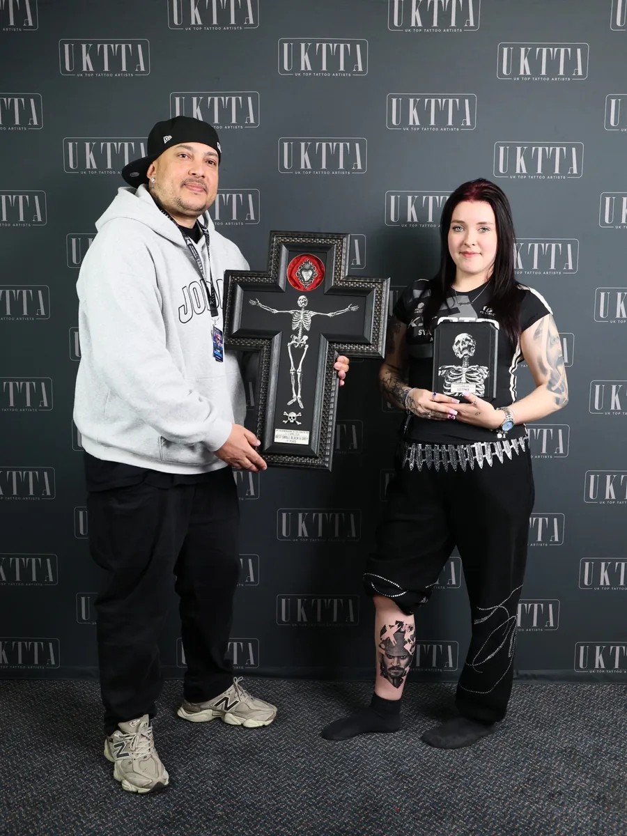Victor Armero with a first place Best Small Black & Grey award at a UK tattoo convention