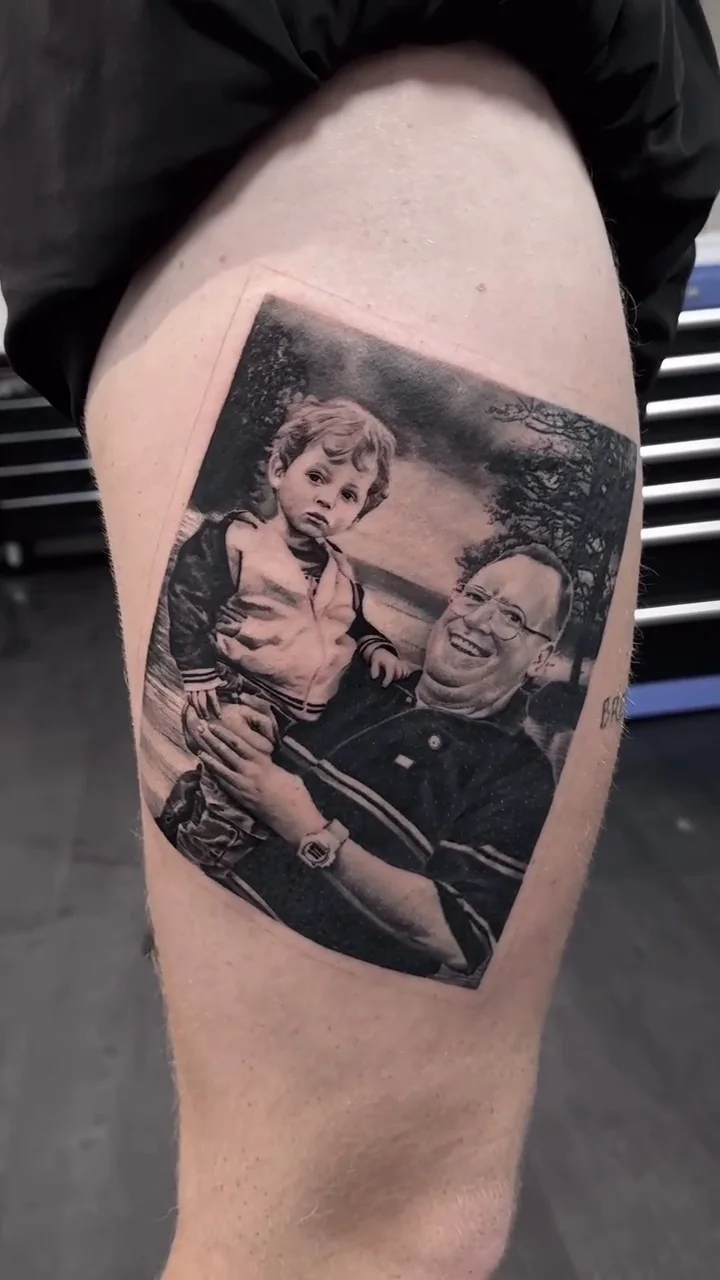 a grandmother and child portrait, framed like a photograph, STYLE tattoo by ARTIST NAME, NEIGHBOURHOOD CITY