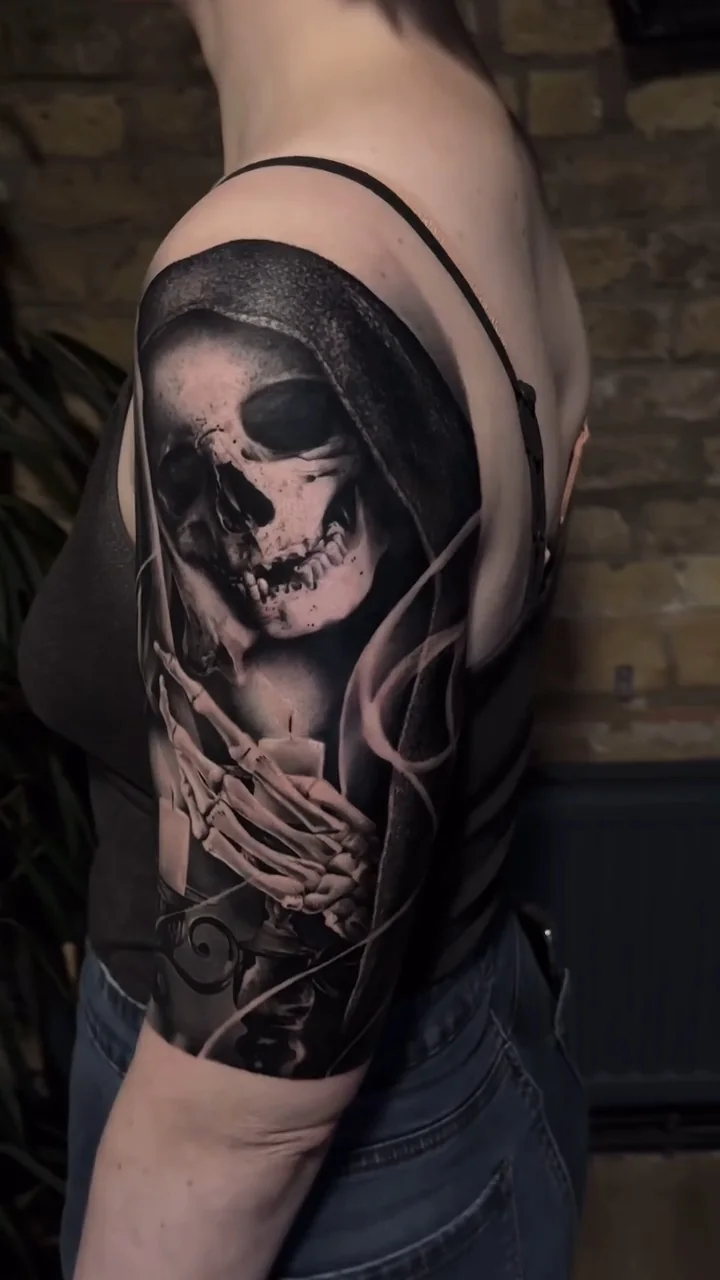a hooded figure with a skull face and skeletal hands, STYLE tattoo by ARTIST NAME, NEIGHBOURHOOD CITY