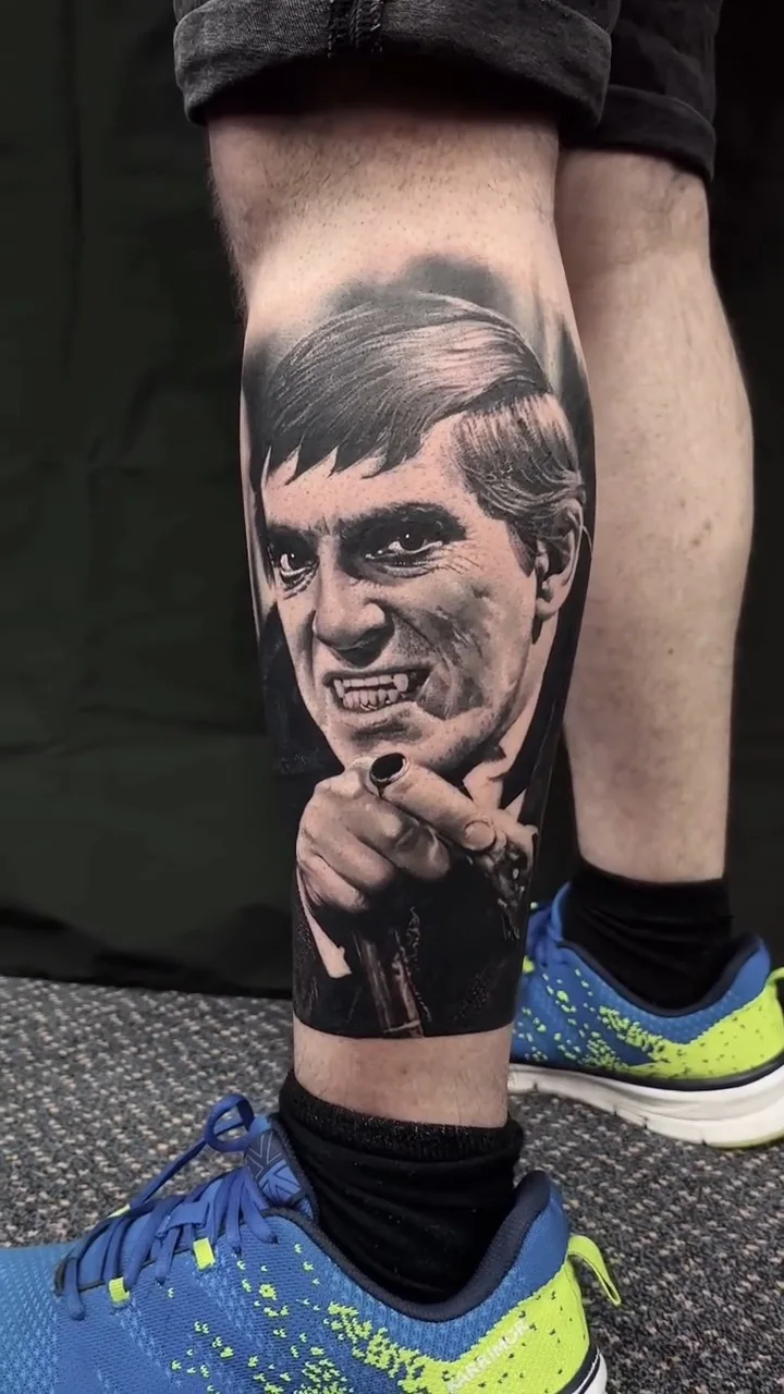 a fanged figure in a suit pointing straight at the viewer, black and grey realism tattoo by Victor Armero, Plymouth