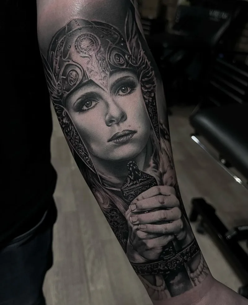 a woman in an ornate helm, forearm piece, STYLE tattoo by ARTIST NAME, NEIGHBOURHOOD CITY