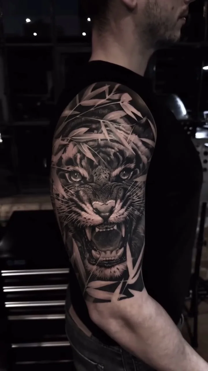 a roaring tiger across the upper arm, STYLE tattoo by ARTIST NAME, NEIGHBOURHOOD CITY